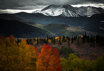 Dramatic Autumn Mountain Landscape with Snow-Capped Peaks