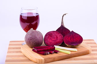 Fresh Beetroot and Juice on Wooden Cutting Board