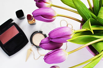 Purple Tulips and Makeup Flat Lay on White Background