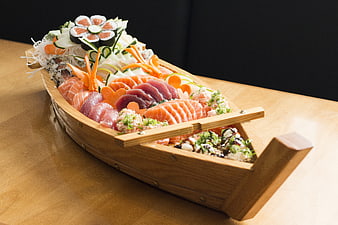 Sushi Platter in Wooden Boat on Table