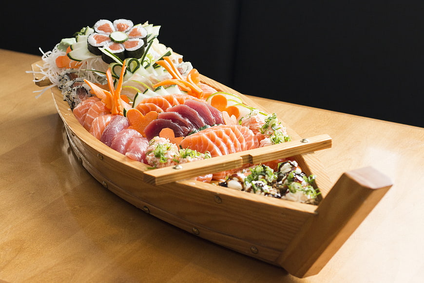 Sushi Platter in Wooden Boat on Table