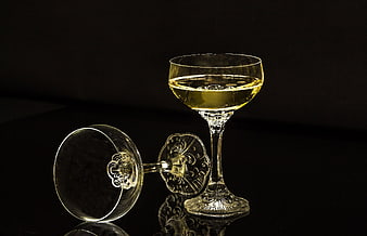 Elegant champagne coupe glasses on black background