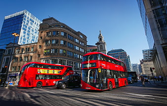 London street scene with red double-decker buses and black taxi