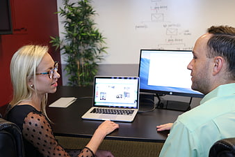 Business meeting with laptop and monitor in modern office