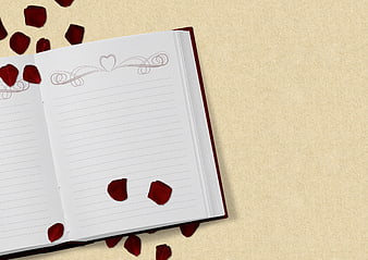 Open Notebook with Red Rose Petals on Beige Background
