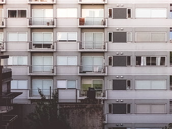 Modern Apartment Building Facade with Balconies and Windows