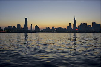 Chicago Skyline Silhouette at Dusk Over Lake Water