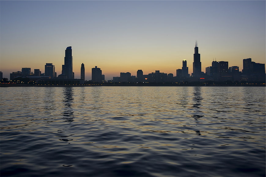 Chicago Skyline Silhouette at Dusk Over Lake Water