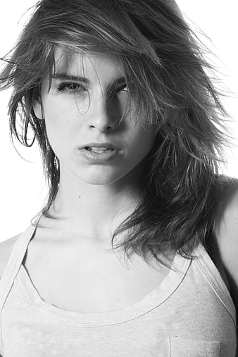 Black and white portrait of young woman with messy hair