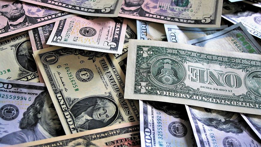 Scattered US Dollar Banknotes Close Up