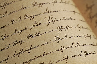 Close-up of vintage handwritten cursive text on aged paper