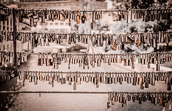 Vintage love locks hanging on bridge cables