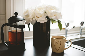 French Press Tea and White Roses on Kitchen Counter