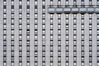 Modern Apartment Building Facade with Vertical Window Pattern