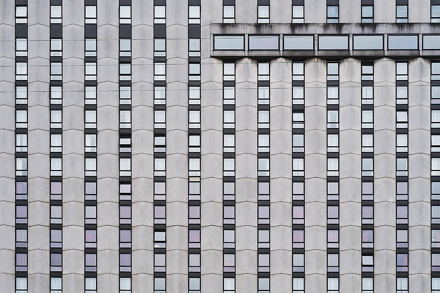 Modern Apartment Building Facade with Vertical Window Pattern