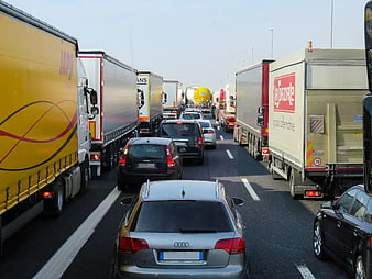 Heavy traffic jam on highway with trucks and cars