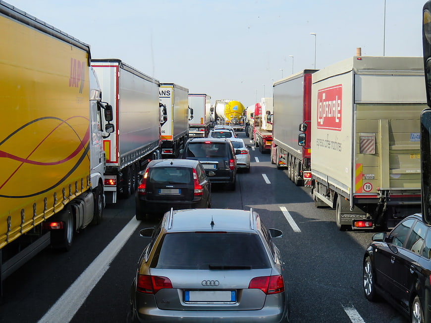 Heavy traffic jam on highway with trucks and cars