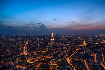 Aerial View of Paris Cityscape at Dusk with Eiffel Tower