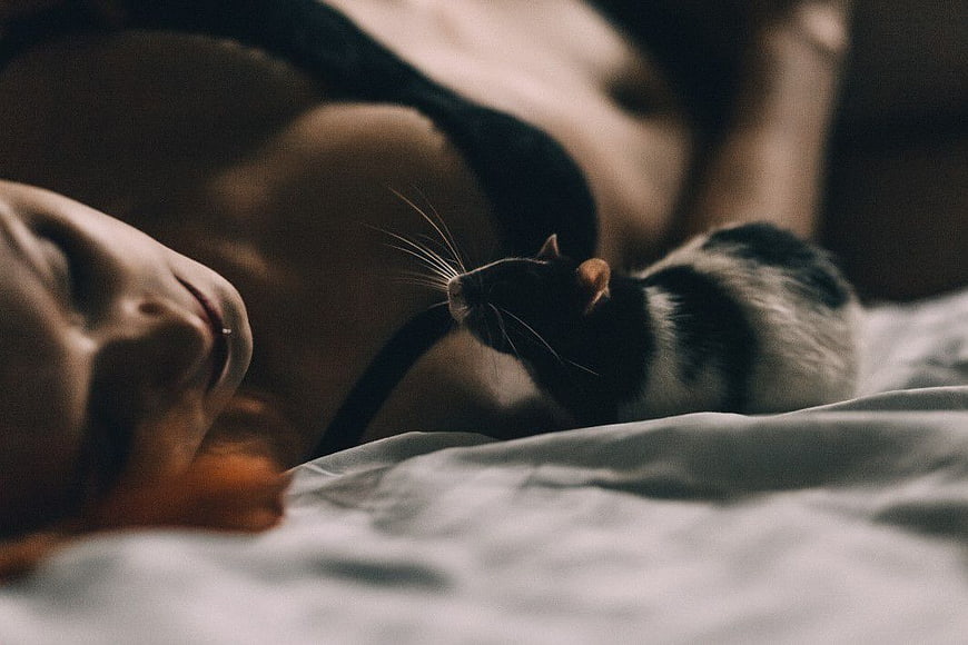 Woman Sleeping in Bed with Pet Rat