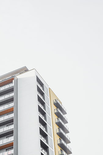 Modern Apartment Building with Yellow and White Facade