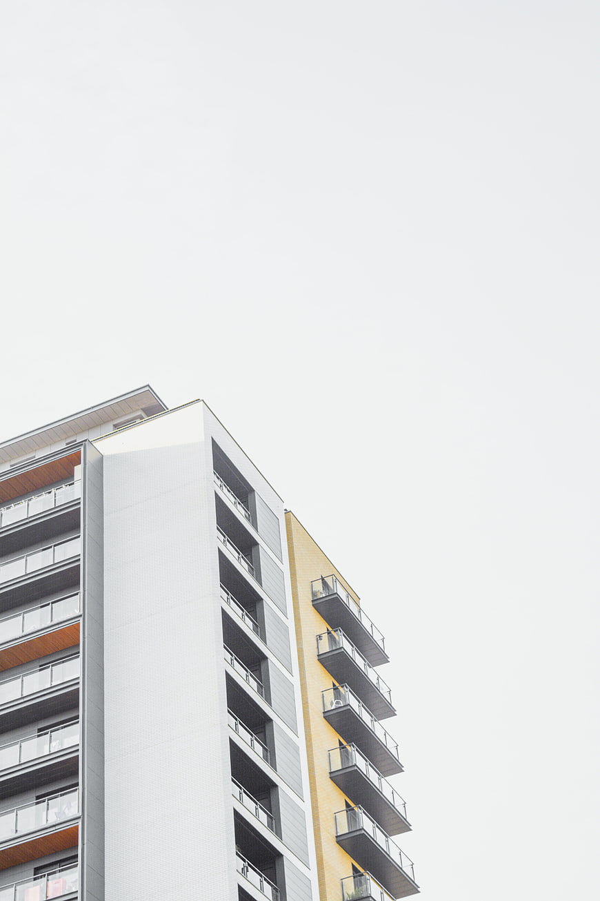 Modern Apartment Building with Yellow and White Facade