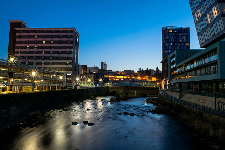 Urban River at Blue Hour with City Lights