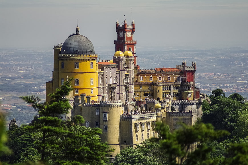 Pena Palace in Sintra, Portugal, featuring colorful architecture and lush greenery