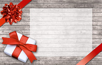 White Gift Box With Red Ribbon On Rustic Wooden Background