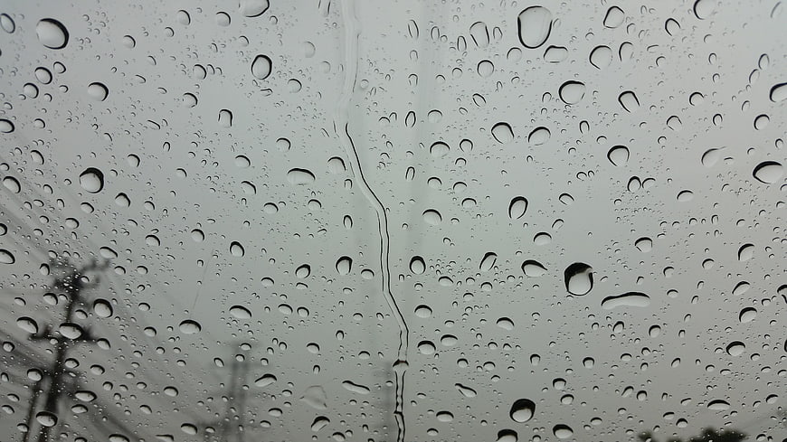 Raindrops on a Window Pane with Blurred Background