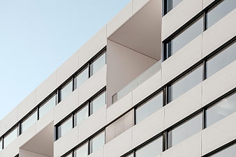 Modern White Office Building Facade with Geometric Windows