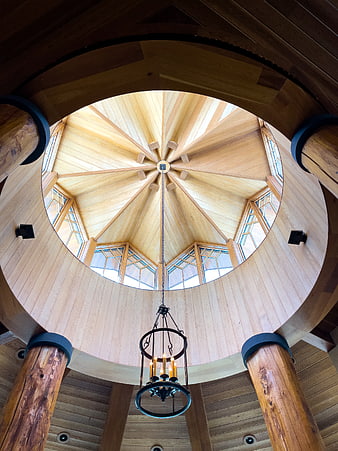 Wooden dome ceiling with skylight and chandelier