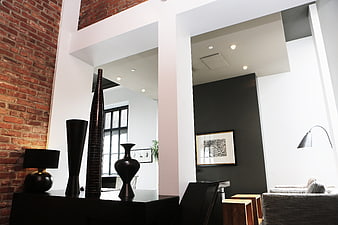 Modern Loft Interior with Exposed Brick Wall and Black Decor