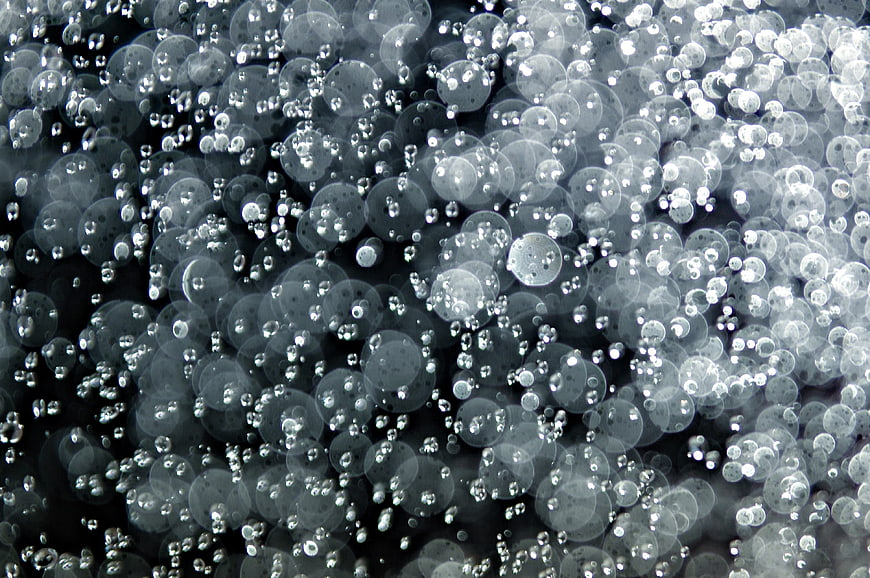 Abstract Blue Water Droplets On Glass Surface