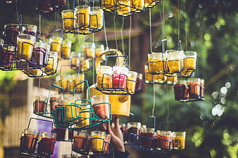 Hanging wire baskets filled with colorful spices and tea outdoors