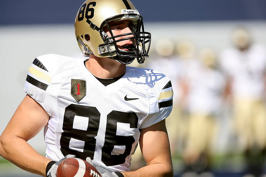 American Football Player in White and Gold Uniform