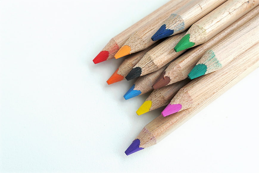 Colorful Wooden Pencils Arranged Diagonally On White Background
