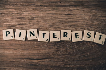 Pinterest spelled with Scrabble tiles on wood