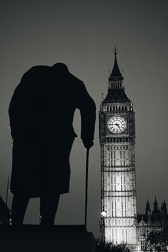 Silhouette of Winston Churchill statue with Big Ben at night