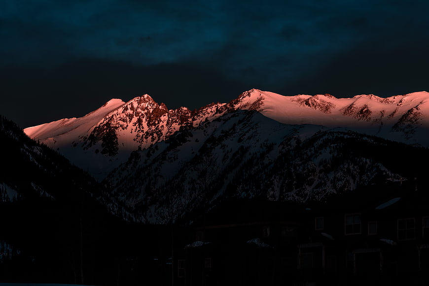 Alpenglow on Snow-Capped Mountain Peaks at Dusk