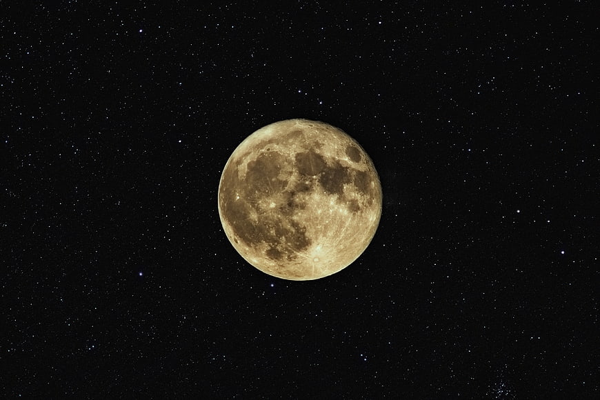 Full Moon in Starry Night Sky with Craters