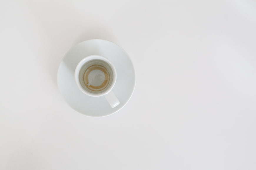 Top View of Empty Espresso Cup on White Background