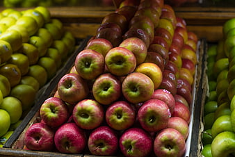 Fresh Red and Green Apples in Wooden Crates at Market