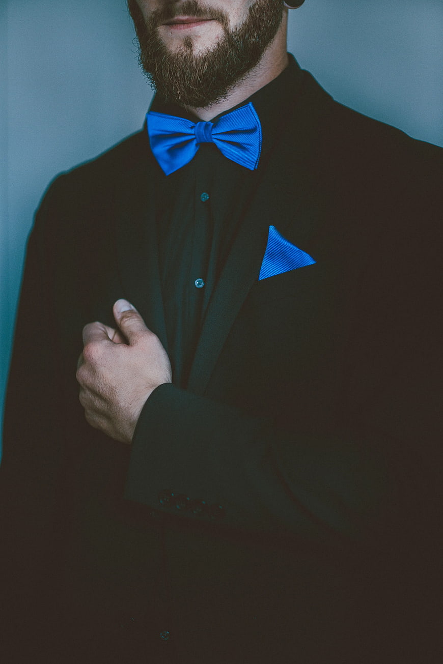 Man in Black Suit with Blue Bow Tie