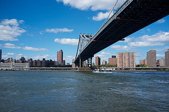 Manhattan Bridge over East River with NYC Skyline