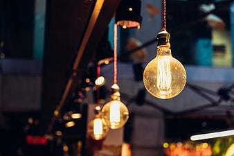 Vintage Edison Bulbs Hanging in Dim Restaurant Interior