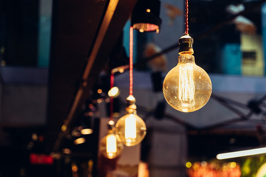 Vintage Edison Bulbs Hanging in Dim Restaurant Interior
