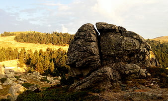 Large Split Rock Formation in Mountain Highland Landscape