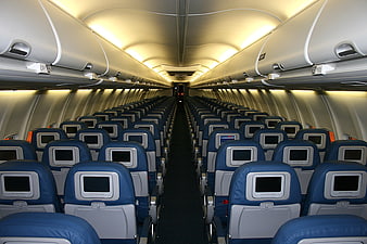 Empty Commercial Airplane Cabin Interior With Blue Seats
