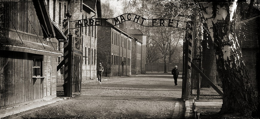 Black and white view of Auschwitz concentration camp entrance gate