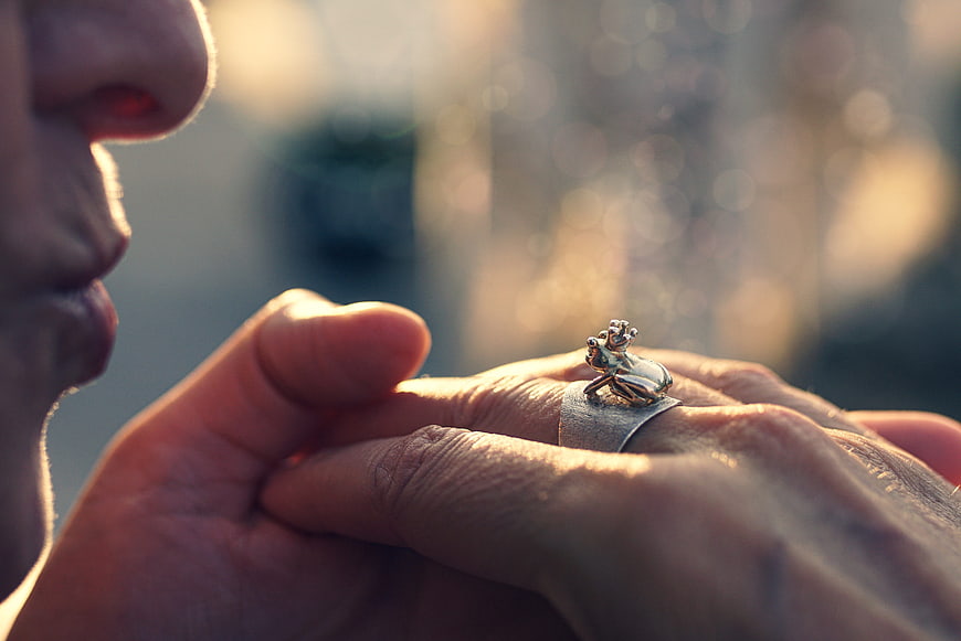 Close-up of a man's hand wearing a silver frog ring
